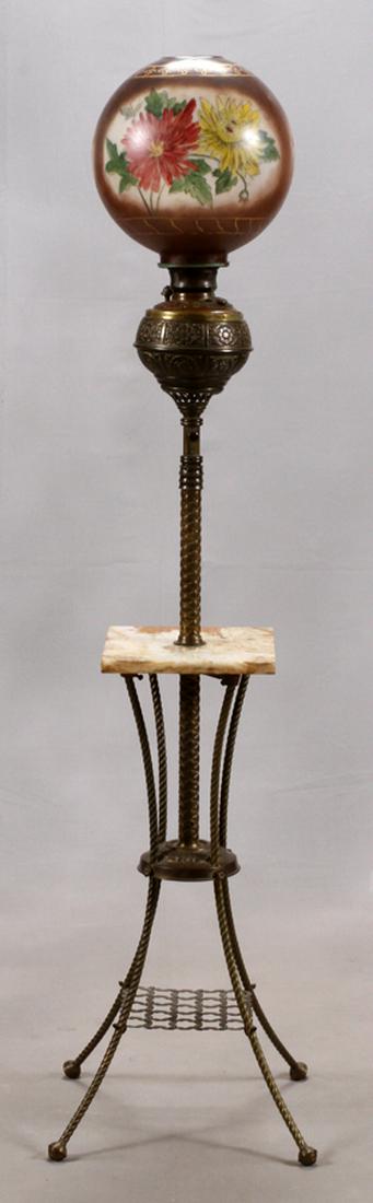 BRASS, MARBLE AND GLASS, ORGAN LAMP, 19TH C: BRASS, MARBLE AND GLASS, ORGAN LAMP, 19TH C, H 64", W 16" :Having a reverse painted globe with a brown ground, flowers and gold-colored trim. mounted on a brass oil reservoir. A twist design center sh