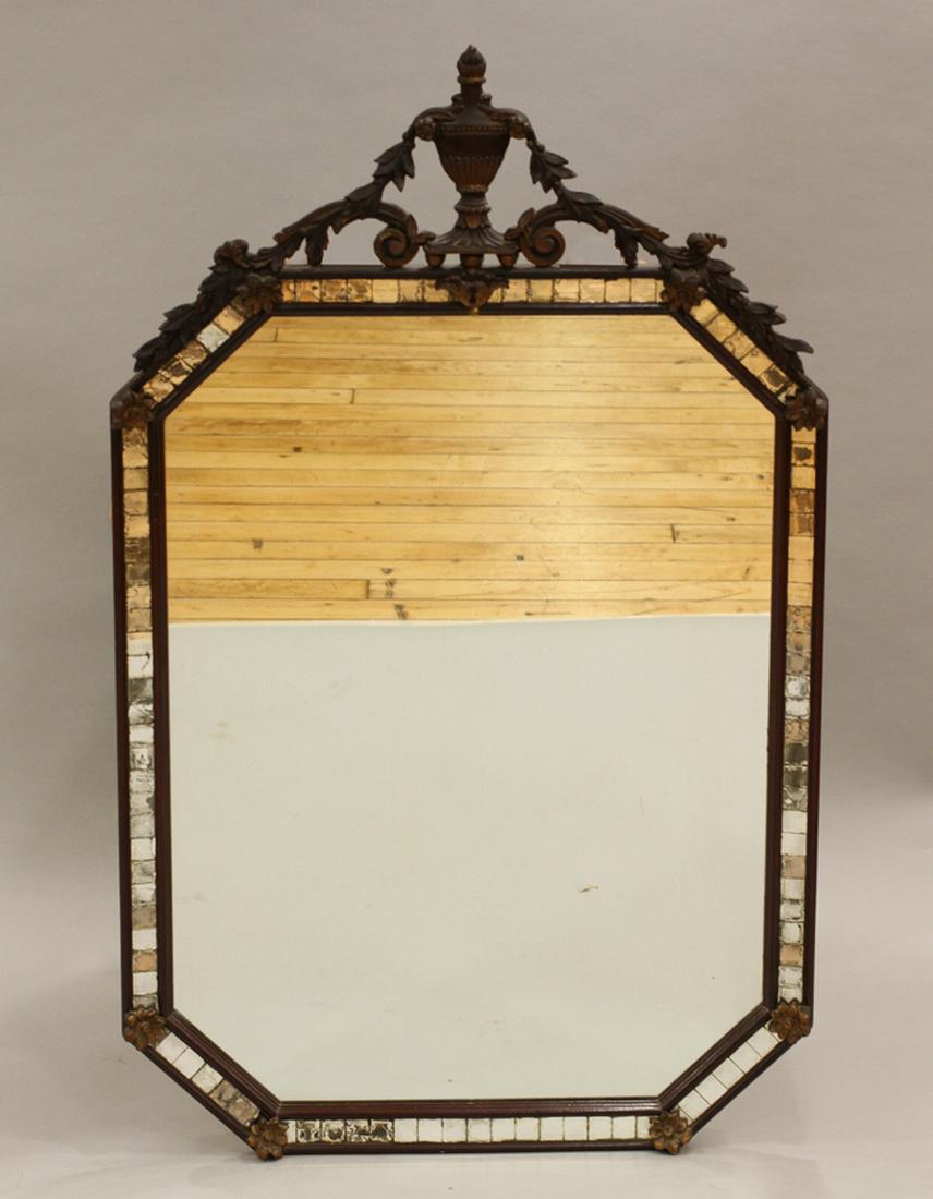 CARVED WOOD MIRROR, H 46.5", W 27": CARVED WOOD MIRROR, H 46.5", W 27" :Having an octagonal shape with an urn finial, canted corners, and a mirrored tile border.