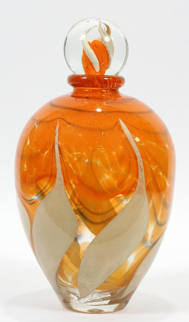 JEAN CLAUDE NOVARO ART GLASS BOTTLE SCULPTURE: JEAN CLAUDE NOVARO (FRANCE, 1943-2014) ART GLASS BOTTLE SCULPTURE H 14" DIA 8" :A Jean Claude Novaro orange art glass bottle sculpture. Having a stopper.
