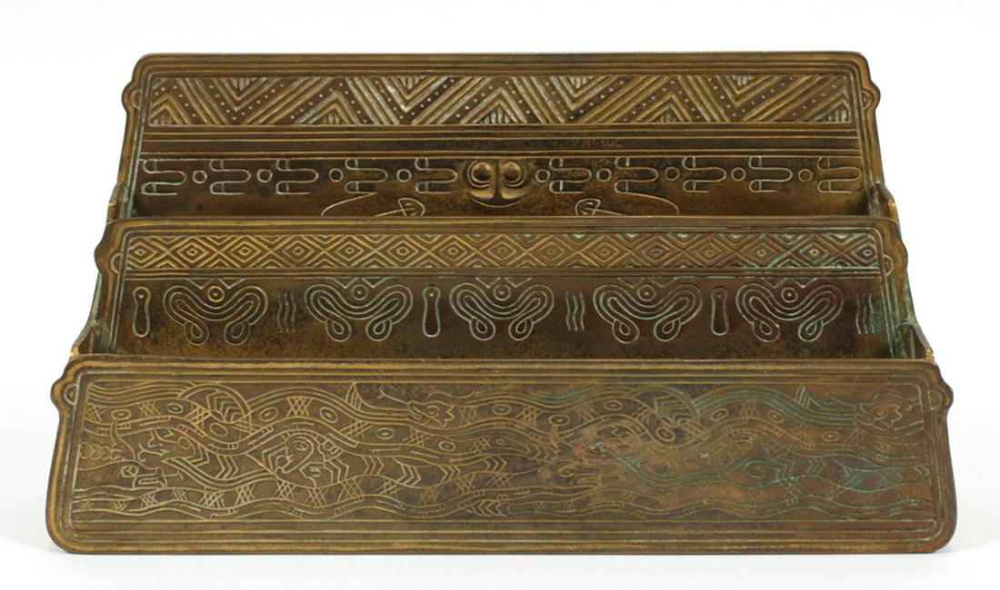 TIFFANY STUDIOS BRONZE LETTER HOLDER: TIFFANY STUDIOS 'AMERICAN INDIAN' BRONZE LETTER HOLDER C. 1900 H 6" L 11" D 2" 1186 :A bronze Tiffany Studios letter holder in the 'American Indian' pattern. Stamped TIFFANY STUDIOS NEW YORK 1186. Act