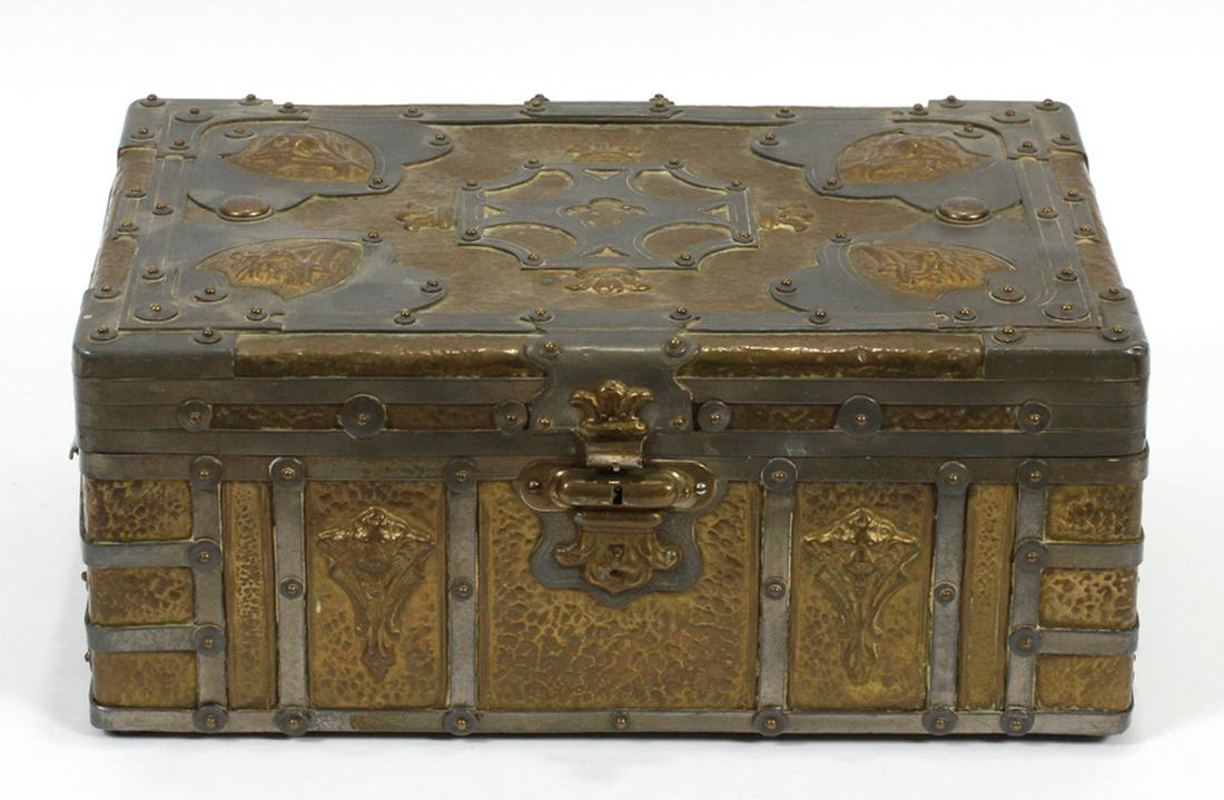 AESTHETIC MOVEMENT METAL CIGAR BOX C. 1885: AESTHETIC MOVEMENT METAL CIGAR BOX C. 1885 H 5" W 9" L 12" :An Aesthetic movement metal cigar box. Having mixed metal, neo-gothic designs, including strapping, crosses, quatrefoils, and animal masks.