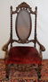 ITALIAN CARVED WALNUT & CANE BACK OPEN ARM CHAIR
