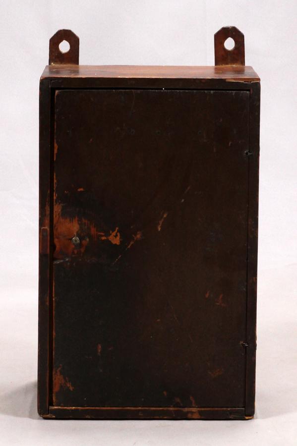 PRIMITIVE PINE, HANGING WALL CUPBOARD, 19TH C.: PRIMITIVE PINE, HANGING WALL CUPBOARD, 19TH C., H 21", W 13", D 8" :A primitive hanging wall cupboard with slots for cutlery. Dating from the nineteenth century.