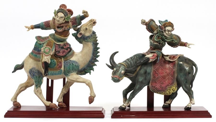 CHINESE GLAZED POTTERY WARRIORS: CHINESE GLAZED POTTERY WARRIORS ON CAMEL AND WATER BUFFALO 2 PCS, H 15", W 12" :Ceramic animated figures riding camel and water buffalo. Hand decorated. Impressed seal mark. Damage to ankle of buffalo