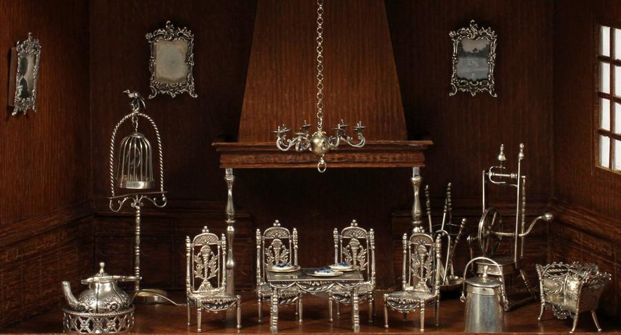 DUTCH SILVER MINIATURE FURNITURE & ACCESSORIES: DUTCH SILVER MINIATURE FURNITURE & ACCESSORIES, 15 PIECES:Four side chairs, center table, settee, bird cage, fireplace tools, flax wheel, wall curio, two frames, tea pot, coffee pot. 15 items. Probabl