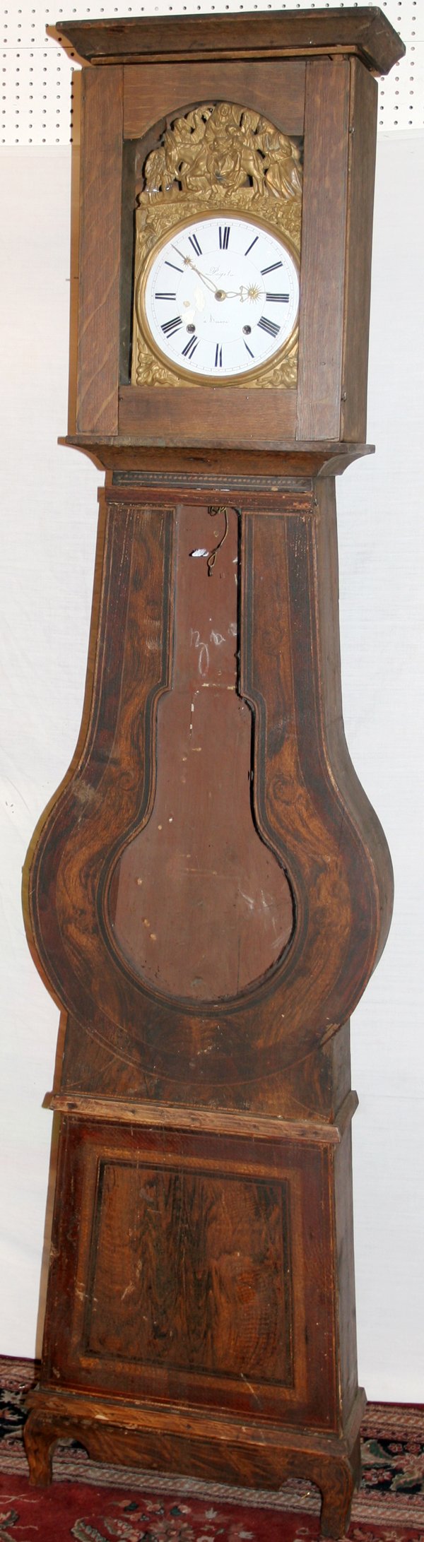 PAGETA WALNUT FRENCH TALL CASE CLOCK C. 1820: PAGETA, WALNUT FRENCH PROVINCIAL TALL CASE CLOCK C. 1820, H 96", W 22":Pendulum shape mid-section. Enamel clock face surrounded by a hand hammered brass scene with a Mother and child on a horse. Signe