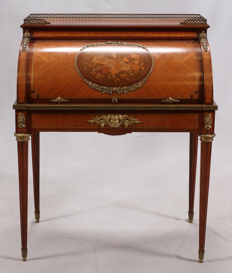 FRENCH, CYLINDER FRONT FRUITWOOD DESK WITH INLAYS: FRENCH, CYLINDER FRONT FRUITWOOD DESK WITH INLAYS C 1900 H 43", W 36", D 22" Black tooled leather writing surface. Circa 1900. Bronze ormolu mounts. Brass gallery. Dovetail construction.