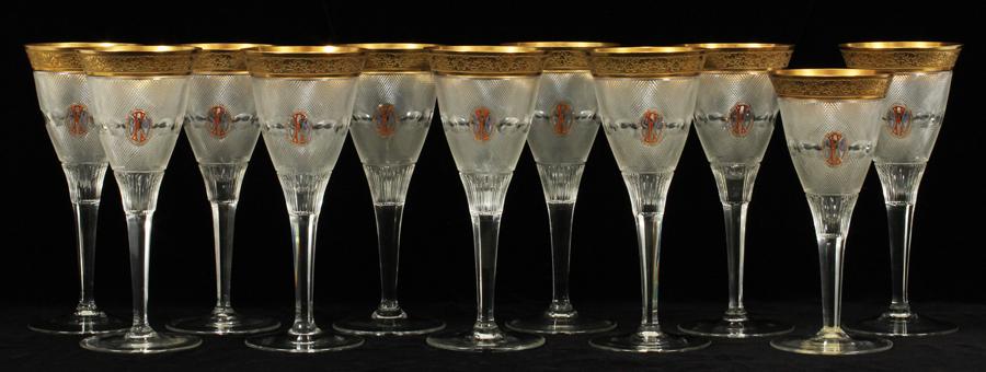 MOSER "SPLENDID" CUT CRYSTAL & ENAMEL GOBLETS: MOSER "SPLENDID" CUT CRYSTAL AND ENAMEL WATER GOBLETS 8.7" SET OF TEN + 1 WINE 8", EX FRED FISHER FAMILY Circa 1920 - 30. Wide fired gold rim. Oval reserve with monogram "SFM". From the estate of Anne