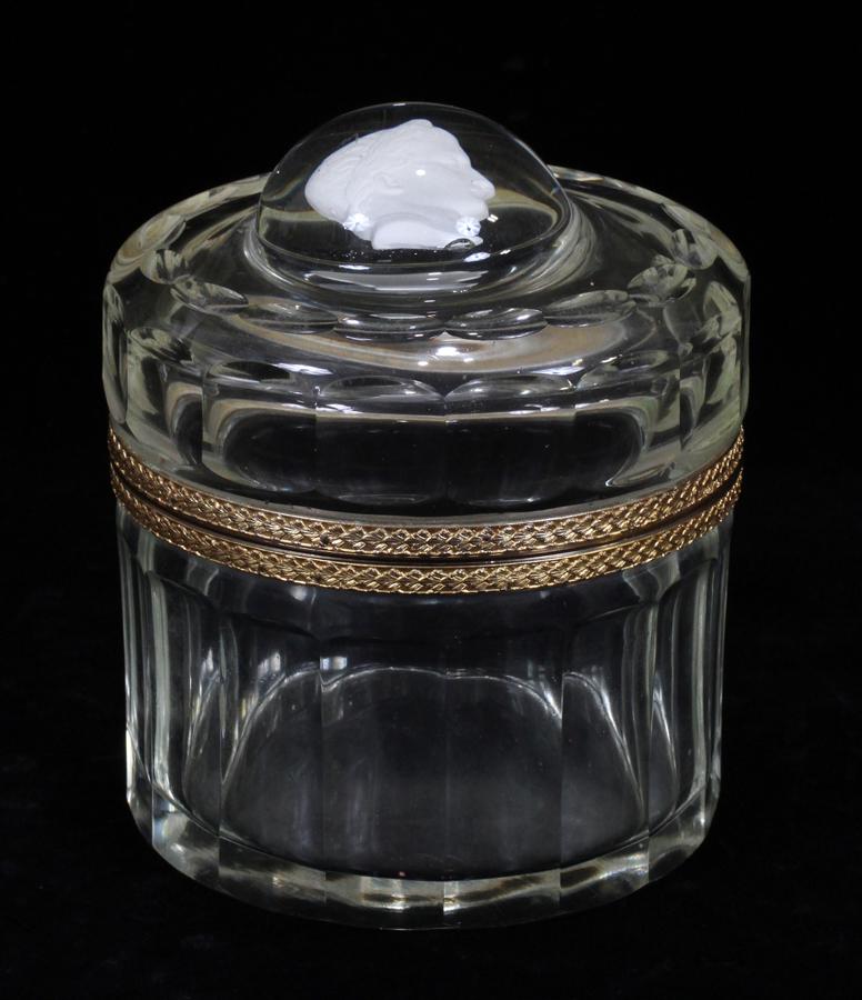 BACCARAT CRYSTAL AND SULPHIDE DRESSER BOX: BACCARAT CRYSTAL AND SULPHIDE DRESSER BOX H 5" D 5" A Baccarat sulphide glass dresser box. Having a bust of Caesar embedded in the hinged lid. Baccarat logo.