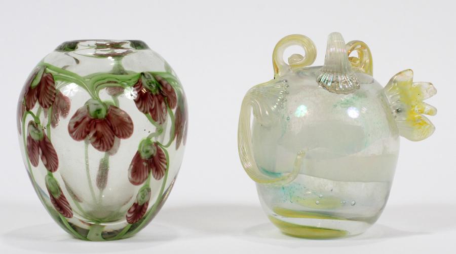 JAMES L. TANNER & UNSIGNED GLASS VASES 2: JAMES L. TANNER & UNSIGNED GLASS VASES 2 H 5" DIA 4" TO 4.5" A James L. Tanner bud vase measuring 4.75" tall with a 4.5" diameter. Also an unsigned vase with purple flowers measuring 5" tall with a 4"