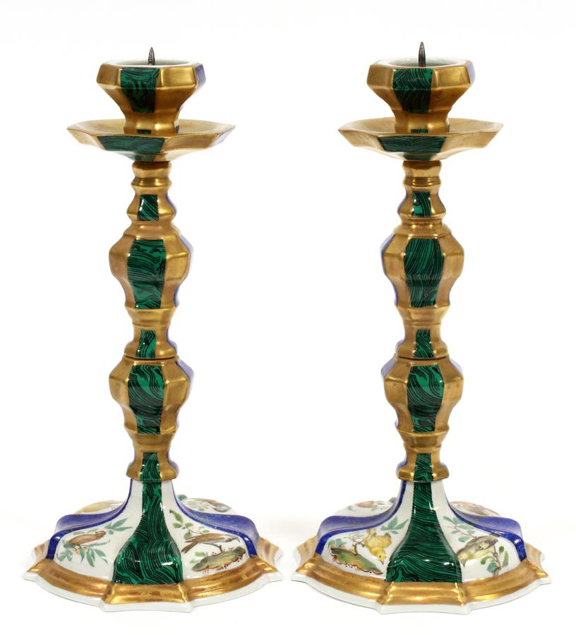 SEVRES FRANCE BIRD MOTIF PORCELAIN CANDLESTICKS: SEVRES FRANCE BIRD MOTIF PORCELAIN CANDLESTICKS H 7.5" DIA 4" A pair of Sevres porcelain candlesticks. Having a hand painted bird motif with faux malachite and lapis painted on the surface. With spike