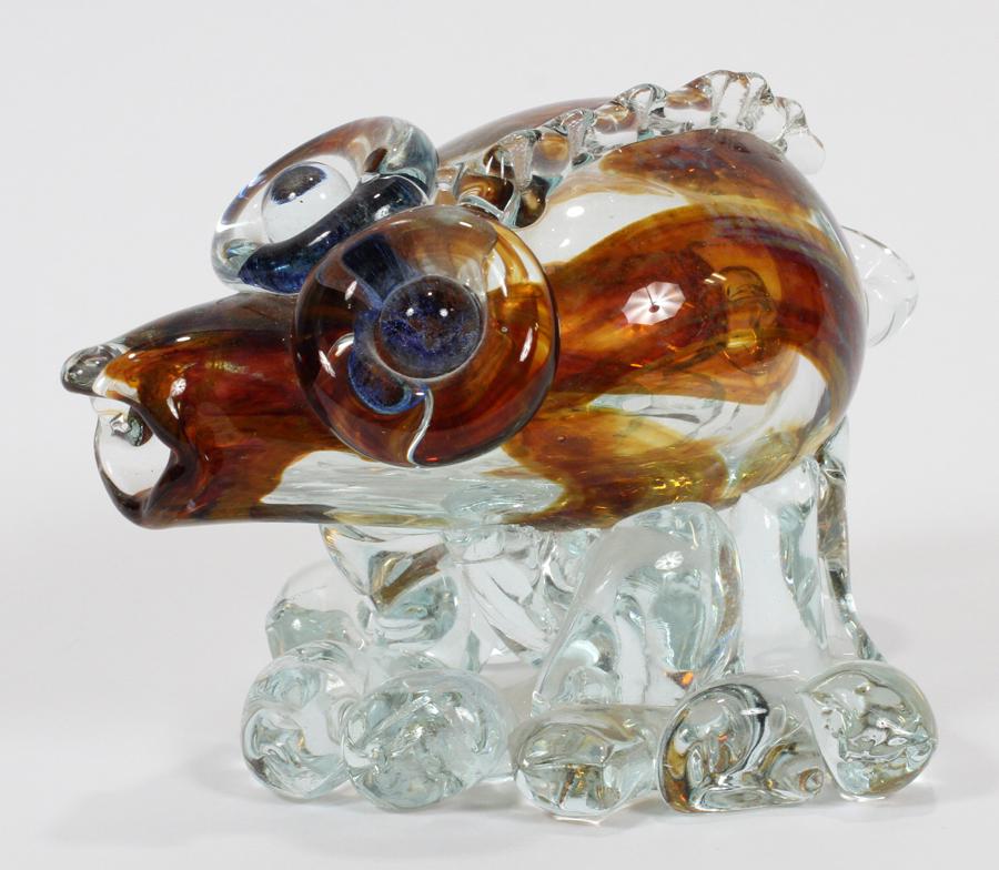 GEORGE THIEWES, GLASS PIG SCULPTURE: GEORGE THIEWES, GLASS PIG SCULPTURE, H 4.5", DIA 7" A whimsical glass pig sculpture by the artist George Thiewes.