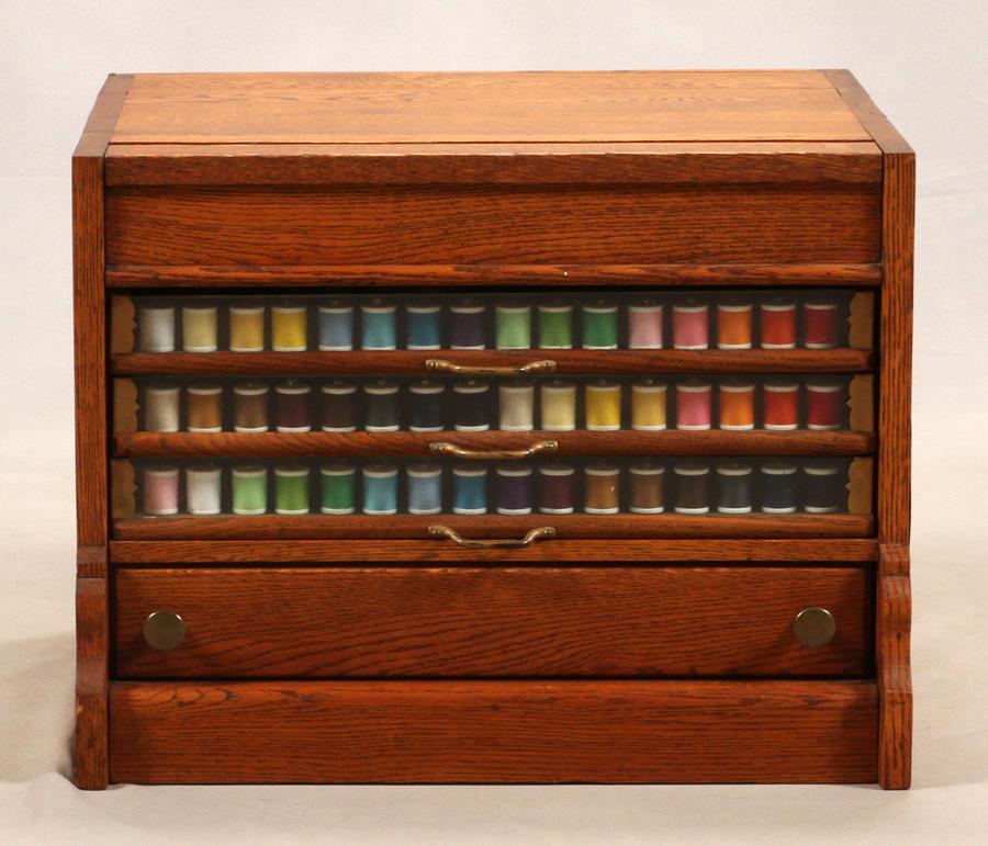 AMERICAN OAK SPOOL CABINET, C. 1880: AMERICAN OAK SPOOL CABINET, C. 1880, H 15.5", W 20", D 18"A counter top American oak spool cabinet.