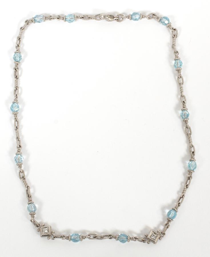 SILVER WITH BLUE TOPAZ AND DIAMOND CHOKER: SILVER WITH BLUE TOPAZ AND DIAMOND CHOKER, L 15 1/4"A blue topaz and diamond choker in an unmarked silver setting. Features two diamonds, at 0.10ct individually. Strongly resembles David Yurman jewelr