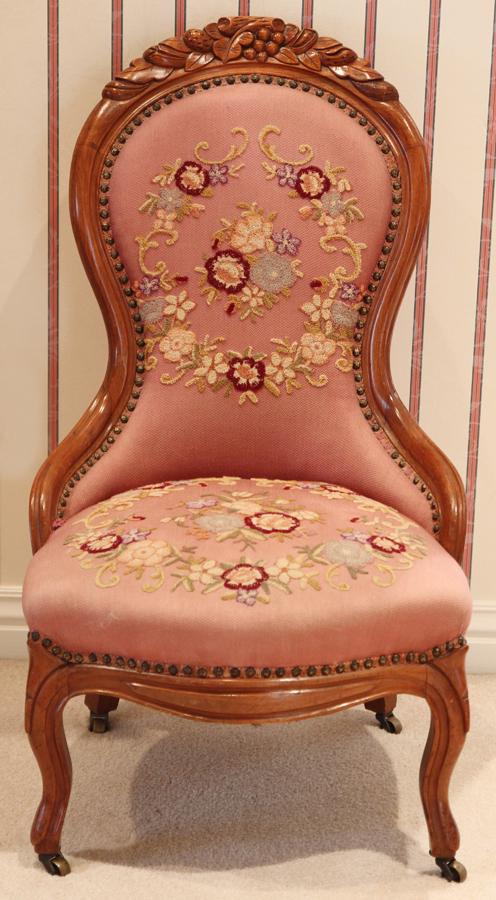VICTORIAN WALNUT LADY'S CHAIR, WITH NEEDLEPOINTE: VICTORIAN WALNUT LADY'S CHAIR, WITH NEEDLEPOINTE C. 1860, H 38", W 22" Pink needlepoint. Hand carved frame. Solid walnut.