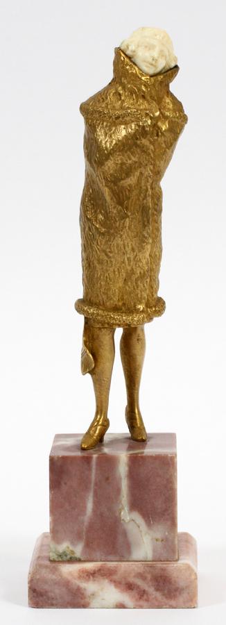 SIGNED FRENCH FLAPPER LADY BRONZE DORE SCULPTURE: SIGNED FRENCH FLAPPER LADY BRONZE DORE SCULPTURE, C 1900 H 7", W 2" Woman wearing 1920's fashion. Having a pink stepped marble base. Illegibly signed on the hem of her coat (see photo detail) - possib