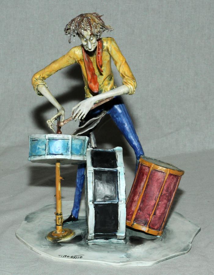 TONI MORETTO LO SCRICCIOLO ART POTTERY SCULPTURE: TONI MORETTO ( ITALIAN 1929 - 2011), LO SCRICCIOLO, HAND CRAFTED ART POTTERY SCULPTURE OF A DRUMMER H 9" W 5" L 7" T. Moretto ( Italian 1929 - 2011), Lo Scricciolo, Hand crafted art pottery sculpture
