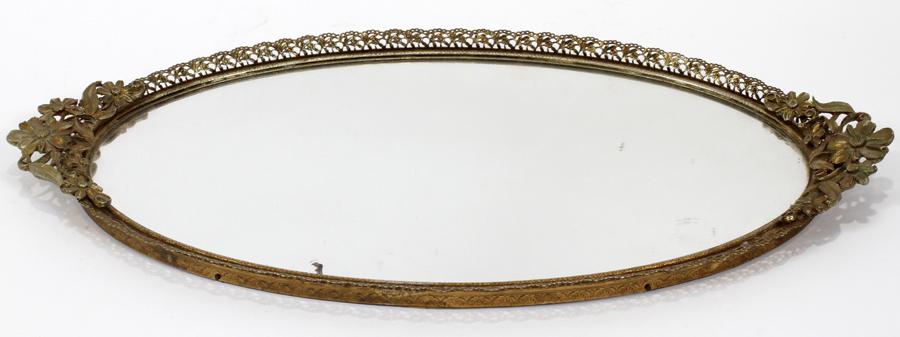 OVAL METAL FRAME WITH MIRROR DRESSER TRAY: OVAL METAL FRAME WITH MIRROR DRESSER TRAY W 9" L 17" Circa 1940. Daisy clusters as handles.