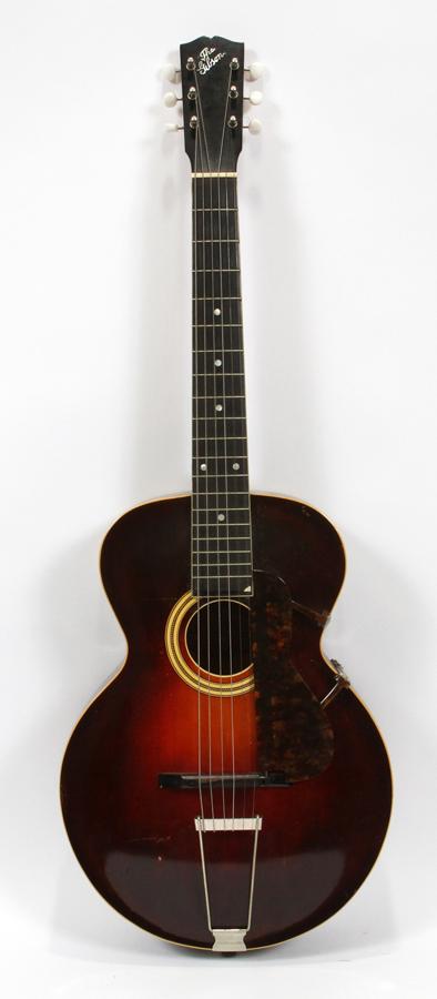 THE GIBSON L-3 ACOUSTIC GUITAR, CA. 1920: THE GIBSON L-3 ACOUSTIC GUITAR, CA. 1920, W 13.5", L 38"A The Gibson L-3 acoustic guitar. Having a dot fingerboard with pearl inlays, a red mahogany sunburst finish and a pic guard. Accompanied by its