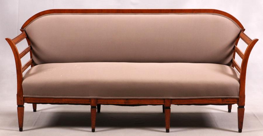 BIEDERMEIER STYLE SETTEE, 19TH C.: BIEDERMEIER STYLE SETTEE, 19TH C., H 35", W 75", D 26"A 19th-century Biedermeier settee having upholstered taupe fabric and ebonized accents to the legs. From the estate of Fred E. Wehmer.