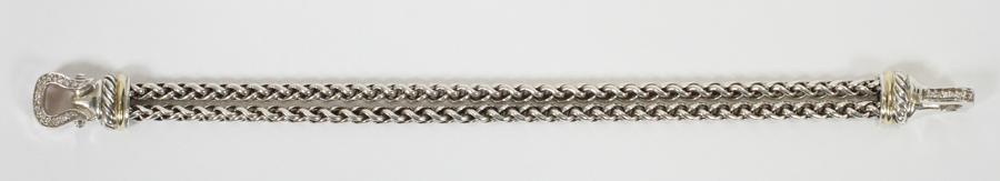 18KT GOLD, STERLING & DIAMOND BRACELET: 18KT GOLD, STERLING & DIAMOND BRACELET, W 3/8", L 7.5", T.W. 0.9 OZT A diamond bracelet featuring an 18kt gold and Sterling silver setting. Total weight: 0.9 grams.