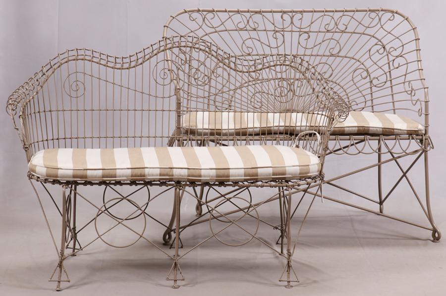 METAL TERRACE SETTEES, TWO W 46", 54": METAL TERRACE SETTEES, TWO W 46", 54" One settee measures 38" H. x 46" W. x 21" D. The second settee measures 35" H. x 54" W. x 24" D. Buff color frames. Complete with seat cushions.