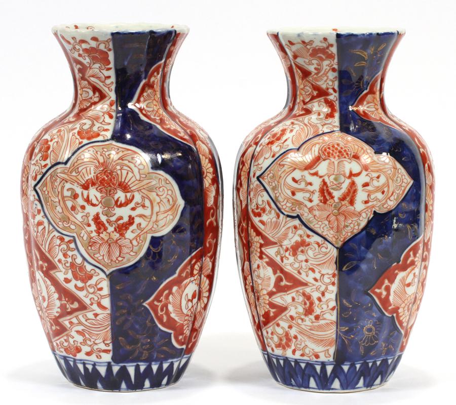 JAPANESE, IMARI PORCELAIN VASES, PAIR: JAPANESE, IMARI PORCELAIN VASES, PAIR, H 9.5", D 5" A pair of Imari porcelain vases. Having faceted sides with a floral motif in blue reds and browns. No marks.