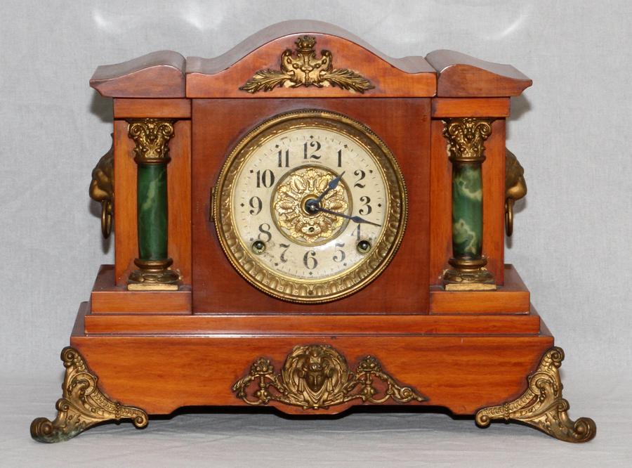 SETH THOMAS MAHOGANY CASE MANTEL CLOCK: SETH THOMAS MAHOGANY CASE MANTEL CLOCK, H 12.5", W 13", D 5.25"A Seth Thomas oak cased mantel clock. The dial is flanked by green adamantine columns and embellished with ormolu mounts. Having Arabic n