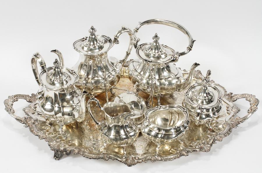 FISHER 'FOOTED DUNCAN' STERLING SILVER TEA SET: FISHER 'FOOTED DUNCAN' STERLING SILVER TEA SET, 7 PCS, 133.05 OZT A Fisher sterling silver tea service set, featuring the 'Footed Duncan' pattern. Comprises of: coffee pot, teapot, water kettle with s