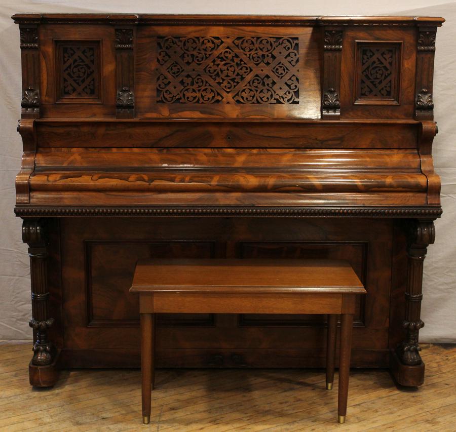 MATHUSHEK ROSEWOOD UPRIGHT PIANO: MATHUSHEK ROSEWOOD UPRIGHT PIANO, H 52.5", W 60", D 23.5"A late 19th century Mathushek upright piano. Encased in rosewood and having ivory keys. Bench measures H 19.5" x W 30" x D 14.5".