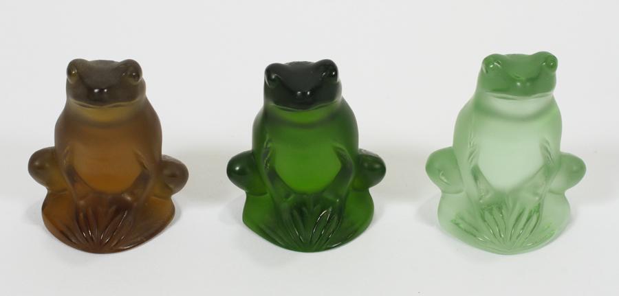 LALIQUE MULTI-COLORED CRYSTAL FROGS, 3 PCS: LALIQUE MULTI-COLORED CRYSTAL FROGS, 3 PCS, H 2.25"A collection of Lalique multi-colored crystal frogs. Each bearing signature branding to the base.