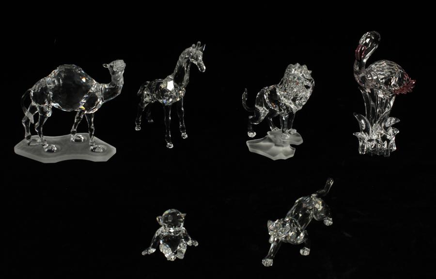 SWAROVSKI CRYSTAL ANIMAL FIGURINES, 6 PCS, H 2"-6": SWAROVSKI CRYSTAL ANIMAL FIGURINES, 6 PCS, H 2"-6"A collection of Swarovski crystal African animal figurines. Comprised of a camel, giraffe, monkey, flamingo and big cats.