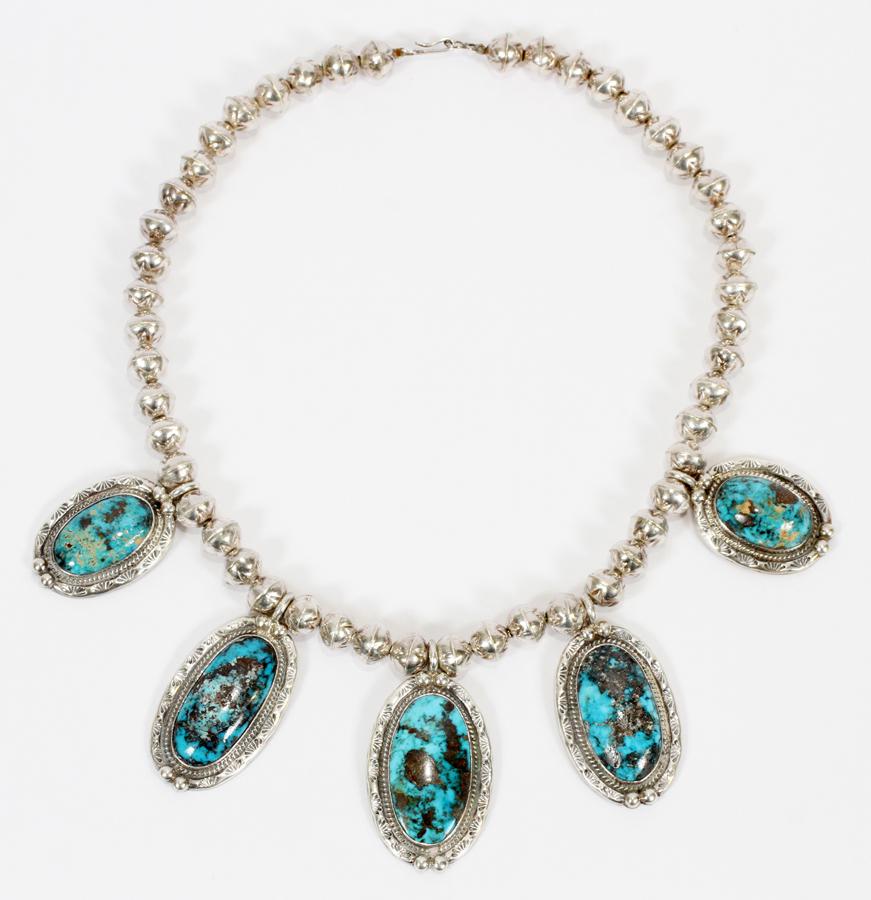SILVER BEAD CHOKER NECKLACE: SILVER BEAD CHOKER NECKLACE Having 5 turquoise and silver pendants. Total weight 125 grams. From the estate of Rose Ann Comstock.