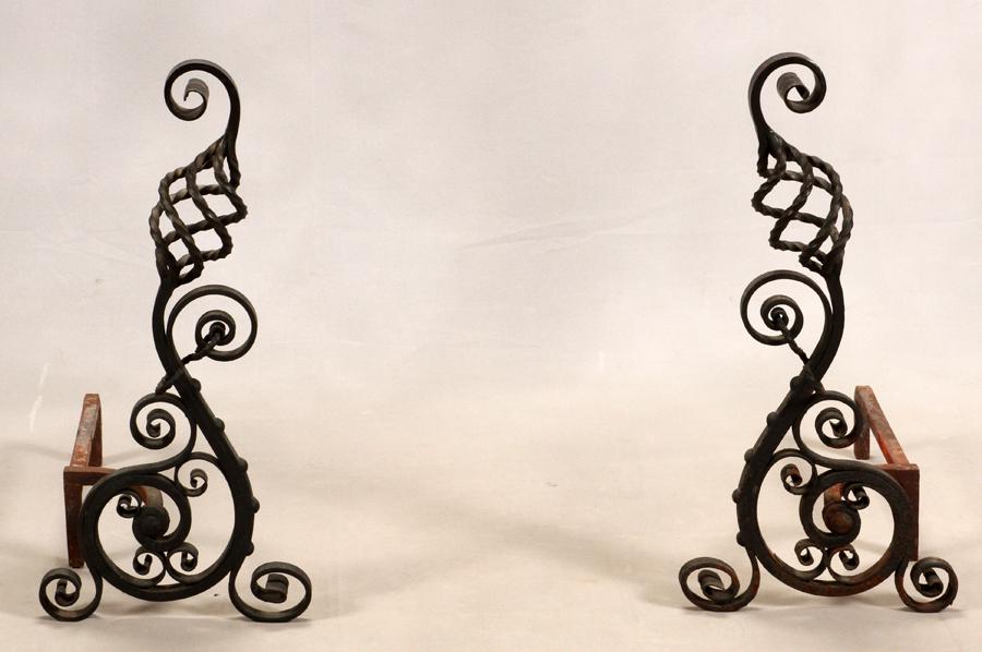 WROUGHT IRON ANDIRONS, 2 PCS., H 27": WROUGHT IRON ANDIRONS, 2 PCS., H 27" Having elaborately scrolled patterns.