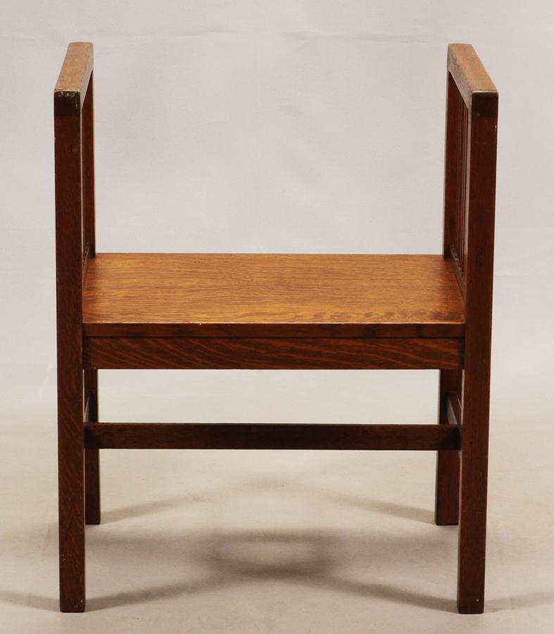 ARTS AND CRAFTS, OAK HALL BENCH: ARTS AND CRAFTS, OAK HALL BENCH, H 30", W 24", D 16.5" A spindle hall bench in the Arts and Crafts style. Having a decal from the Michigan Chair Company.