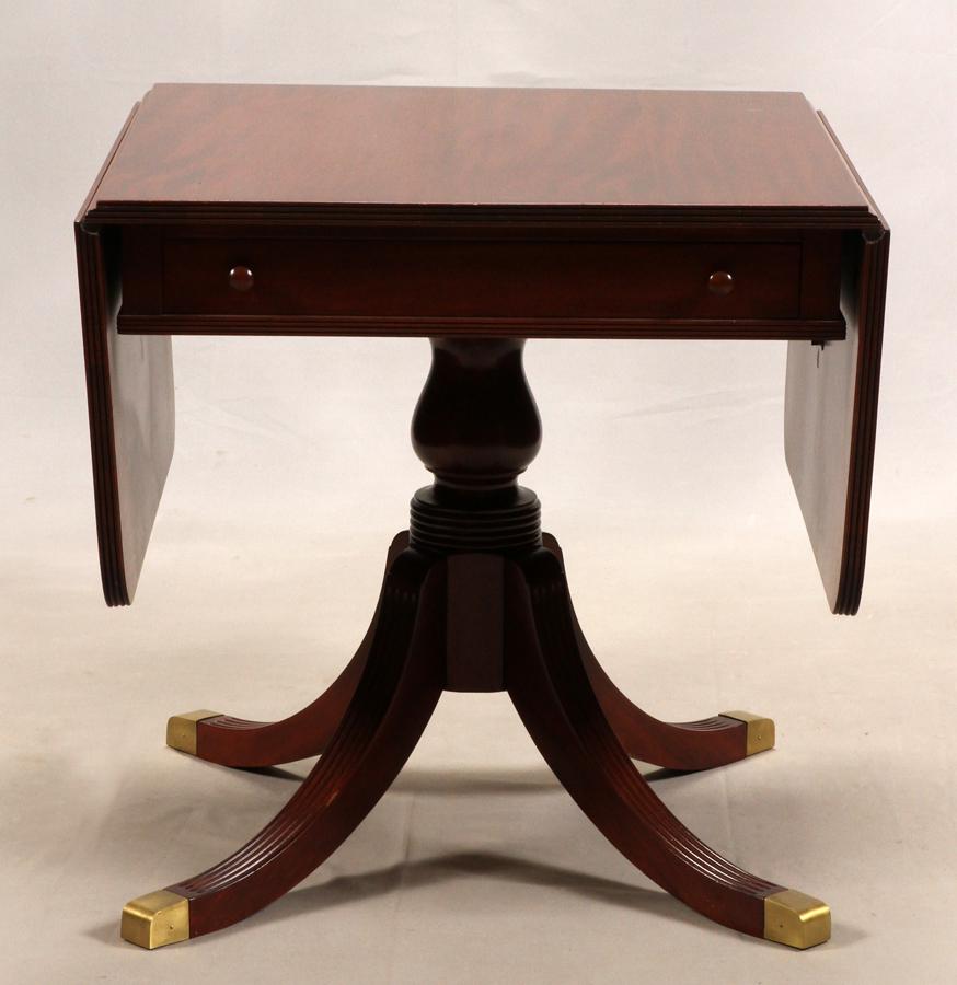 MAHOGANY DROP LEAF TABLE, C. 1940: MAHOGANY DROP LEAF TABLE, C. 1940, H 30", W 30", L 30" Having a pedestal base with 1 drawer. Drop leaves 16", open to 62". Duncan Phyfe style.