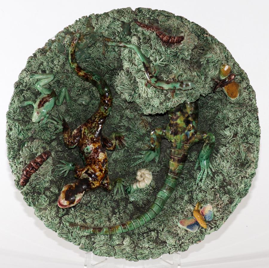 PALISSY PORTUGUESE MAJOLICA PLAQUE: PALISSY PORTUGUESE MAJOLICA PLAQUE, DIA 11", LIZARD & FROGS A Portuguese majolica plate designed by Jose A. Cunha. Depicting a detailed composition of fish, eel and shells. Maker's marks to the unders