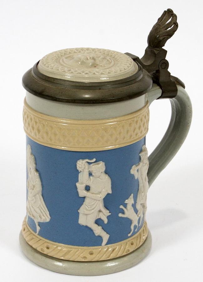 VILLEROY & BOCH, GERMAN STONEWARE STEIN, C 1900: VILLEROY & BOCH, GERMAN STONEWARE STEIN, C 1900 H 1/4" Pewter rim & hummel gilt H 5" figures with low relief.