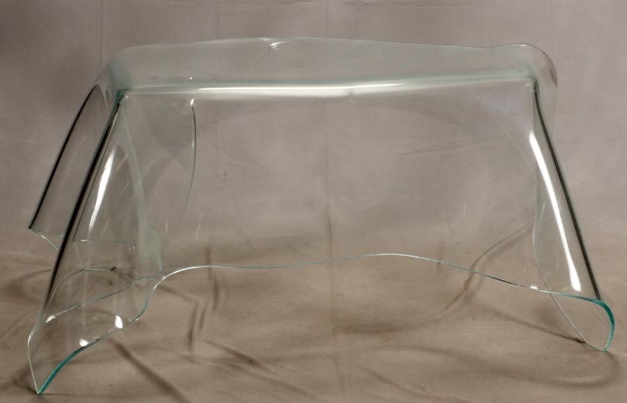 LAUREL FYFE MODERNIST BENT GLASS, HANDKERCHIEF TABLE: LAUREL FYFE (AMERICAN, 1956-2011) MODERNIST BENT GLASS, HANDKERCHIEF TABLE, H 26", L 62", D 44" In the form of a handkerchief with the sides draped down and the corners form the legs.