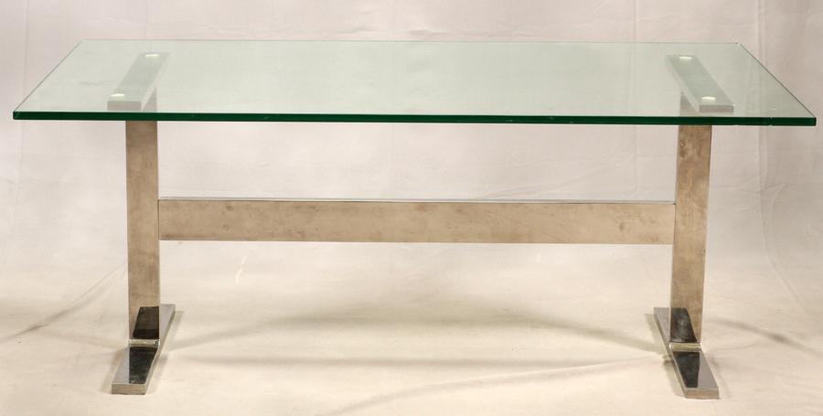MODERN, CHROME AND PLATE GLASS TABLE: MODERN, CHROME AND PLATE GLASS TABLE, H 27", W 36", L 66" Milo Baughman style. The chrome center supports trestle style legs.
