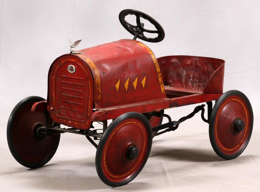 AMERICAN NATIONAL RACER PRESSED STEEL PEDAL CAR: AMERICAN NATIONAL RACER PRESSED STEEL PEDAL CAR C. 1917 H 23" W 22" L 35" An American National Racer pressed steel pedal car. Circa 1917. Painted red with yellow trim. All measurements are approximate