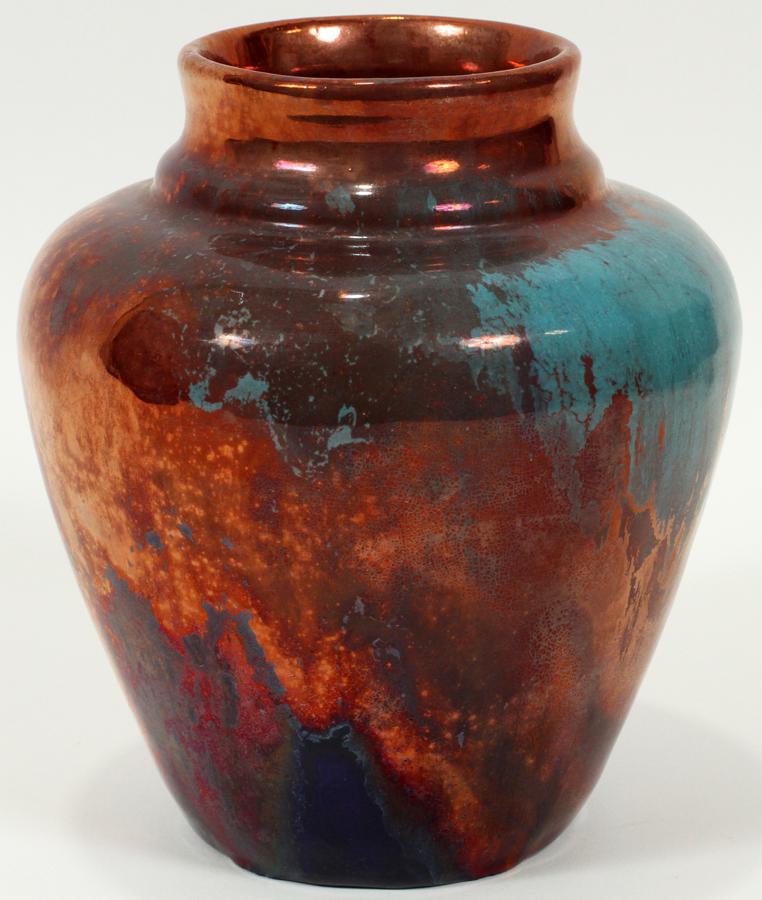 IRA & ELLA PETERS, PEWABIC POTTERY VASE, 1976: IRA & ELLA PETERS, PEWABIC POTTERY VASE, 1976, H 6", DIA 5"An Ira and Ella Peters Pewabic Pottery vase. Having a drip iridescent glaze with observable oxidation, pitting and reduction. Incised "IRA," 