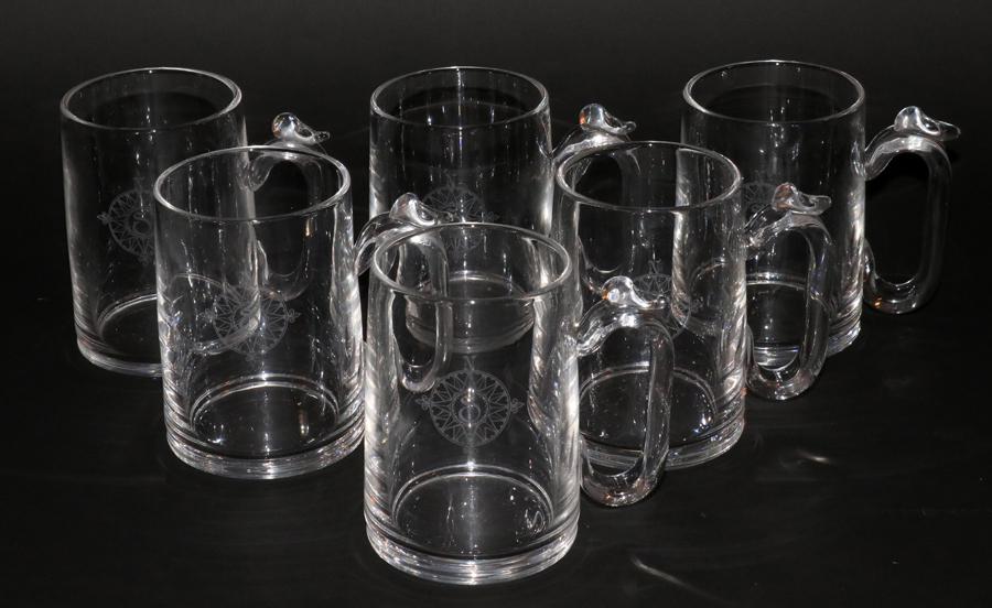 STEUBEN GLASS BEER MUGS, 6 PCS, "S'' H 5": STEUBEN GLASS BEER MUGS, 6 PCS, "S'' H 5" A collection of six Steuben glass beer mugs. Presented in original Steuben box. All signed and monogrammed ("S") in a compass motif. Property of Robert Schwei