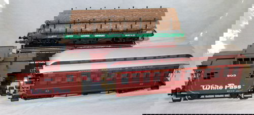 BACHMANN "BIG HAULERS" "G" SCALE TRAIN CARS, 3: Includes (1) "Coal Creek Lumber" flat car w/logs, #93541, (1) "Atchison Topeka & Santa Fe" passenger car, #93, (1) "White Pass", 4 wheel, 903 caboose, #93119 W/2 boxes