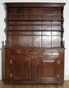 AMERICAN PENNSYLVANIA WALNUT PEWTER CUPBOARD, C: Three drawers at the frieze above two paneled doors. Peg construction. Provenance, owned by Ledlie L. Laughlin, of Princeton, New Jersey, author of "Pewter in Americfrom Williams on file. Original