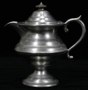 AMERICAN PEWTER CREAM JUG, WILLIAM WILL, PHILAD: Purchased from Thomas Williams. No touch marks. Helmet-shape, scroll handle, wood knob. Pedestal base. Ex collection of Helen Muehlenbeck.