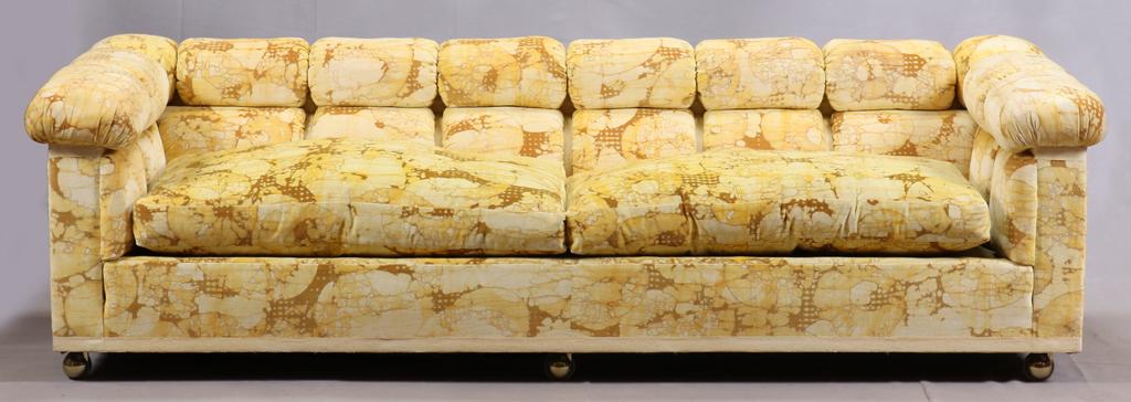 DUNBAR SOFA, H 24", W 88", D 33": DUNBAR SOFA, H 24", W 88", D 33" Two down-filled seat cushions, tufted back, and sides. Hand-painted fabric with a yellow water-lily design by Jack Lerner Larson. Fabric is documented in a book.