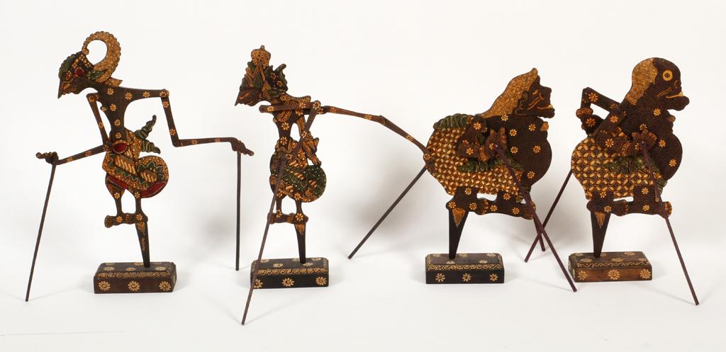 INDONESIAN SHADOW PUPPETS, 4 PCS, H 14": INDONESIAN SHADOW PUPPETS, 4 PCS, H 14"Each having mosaic patterns with flowers, pivoting limbs, and gilt tones. All mounted on rectangular bases. From the estate of Gerald Torrence, Chicago.