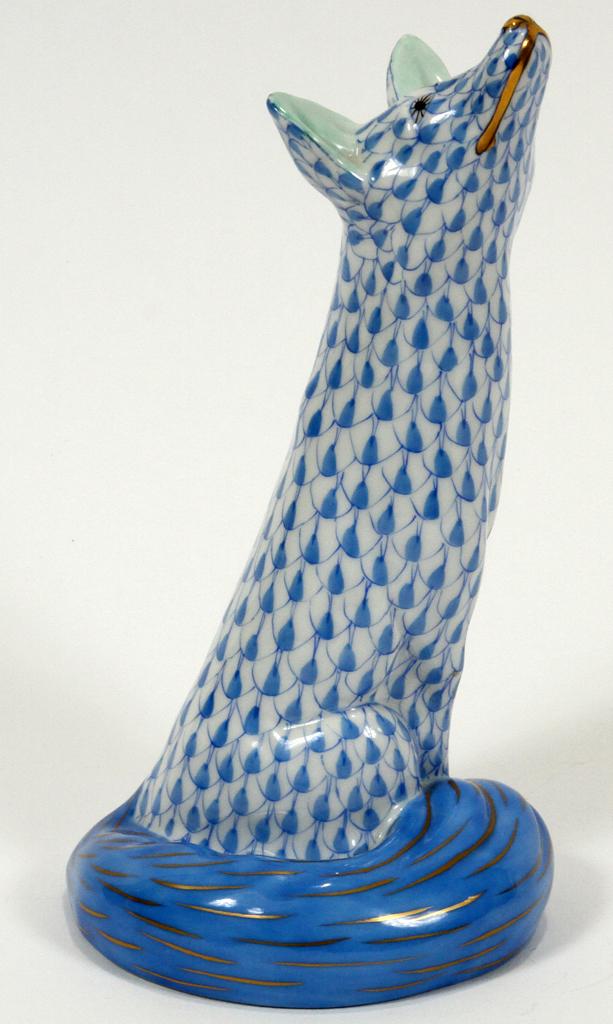 HEREND PORCELAIN FOX FIGURINE, H 6.5", L 3.5": HEREND PORCELAIN FOX FIGURINE, H 6.5", L 3.5"A Herend of Hungary hand-painted porcelain figurine. Depicting a seated fox with an upward gaze. Features a cobalt fishnet motif accented with gilt trim. S