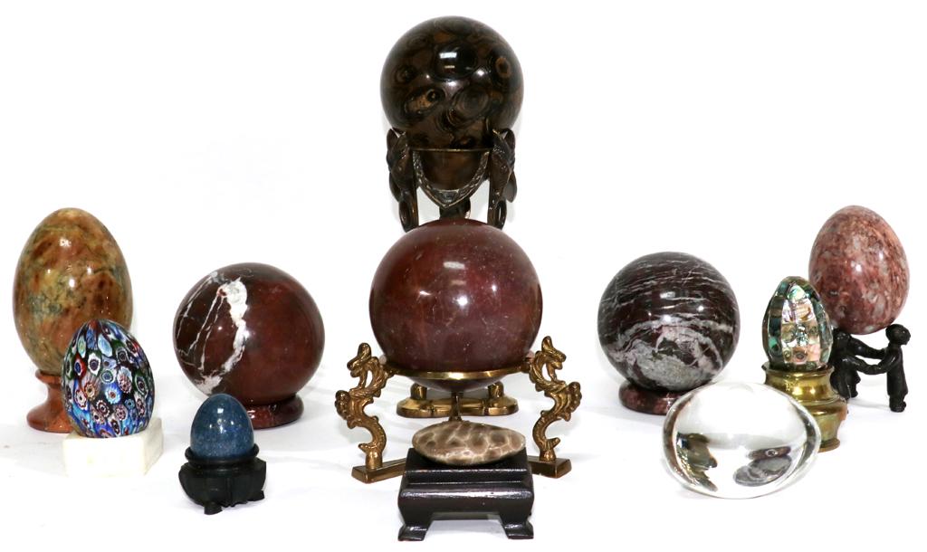 HARDSTONE SPHERES, ETC. 11 PCS.: HARDSTONE SPHERES, ETC. 11 PCS. Four hardstone spheres, large approx 4" plus others. Millefiori Italian, blown glass egg. Some on brass, marble, or wood stands. From the collection of Robert Schweizer